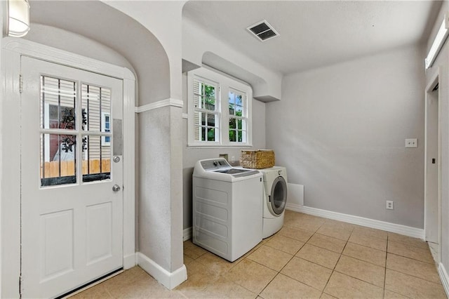 4752 Demontluzin St, New Orleans, LA 70122 - laundry area with independent washer and dryer and light tile patterned flooring