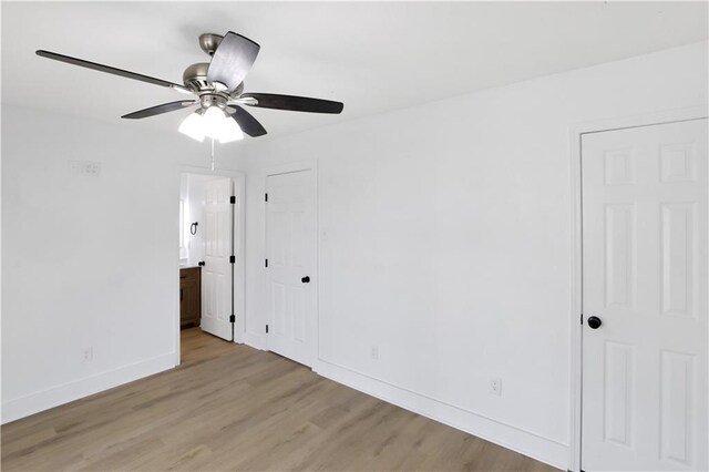 1909 Maryland Ave, Kenner, LA 70062 - unfurnished bedroom with light wood-style floors, ensuite bathroom, and ceiling fan