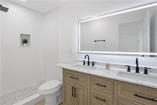 1909 Maryland Ave, Kenner, LA 70062 - full bathroom featuring double vanity and a tile shower