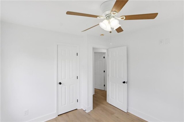 1909 Maryland Ave, Kenner, LA 70062 - unfurnished bedroom with light wood-style flooring, a closet, and a ceiling fan