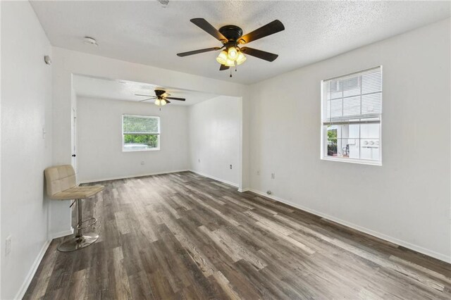4601 Reynes St, New Orleans, LA 70126 - spare room featuring wood finished floors, ceiling fan, and a smoke detector