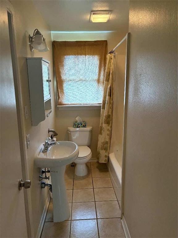 121 Sigma St, Belle Chasse, LA 70037 - full bath with tile patterned floors and shower / bath combo