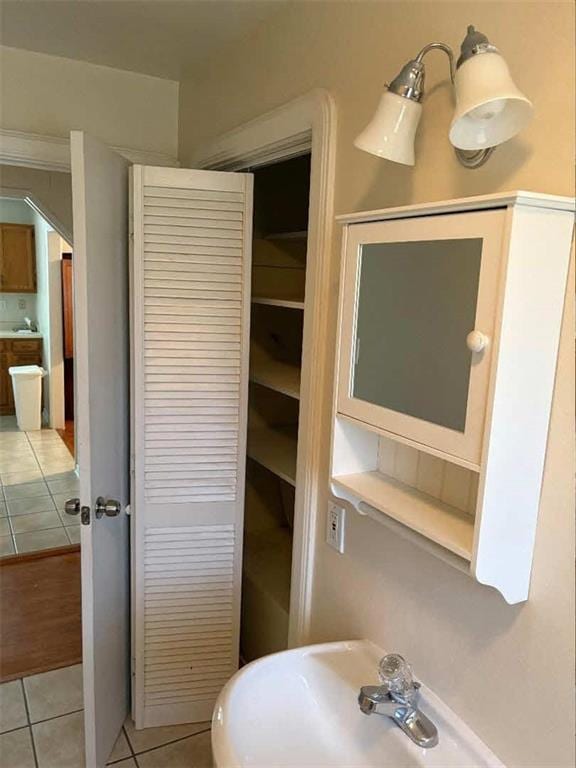 121 Sigma St, Belle Chasse, LA 70037 - bathroom featuring tile patterned flooring and a sink