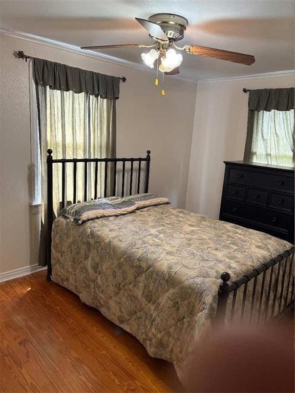 121 Sigma St, Belle Chasse, LA 70037 - bedroom with ornamental molding, wood finished floors, and a ceiling fan
