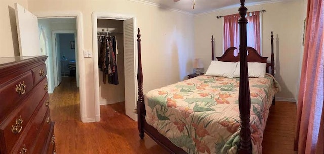 121 Sigma St, Belle Chasse, LA 70037 - bedroom featuring light wood-style flooring, crown molding, and a closet