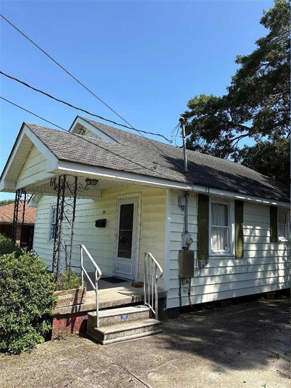121 Sigma St, Belle Chasse, LA 70037 - view of front of property with a shingled roof