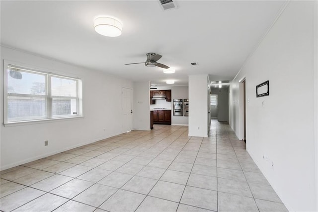 4517 Purdue Dr, Metairie, LA 70003 - unfurnished living room with a ceiling fan and light tile patterned floors