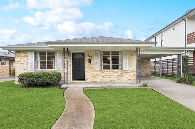508 Beverly Garden Dr, Metairie, LA 70005 - view of front of home with concrete driveway, a front lawn, brick siding, and covered porch
