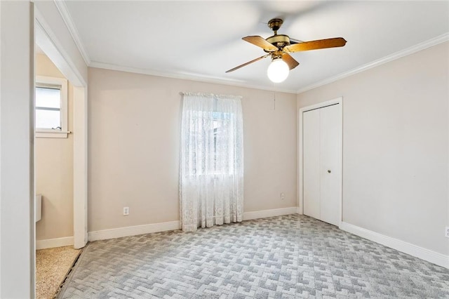 508 Beverly Garden Dr, Metairie, LA 70005 - empty room featuring ceiling fan, healthy amount of natural light, ornamental molding, and carpet