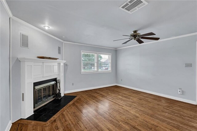 174 Celia Dr, Luling, LA 70070 - unfurnished living room featuring ornamental molding, a fireplace with flush hearth, ceiling fan, and wood finished floors
