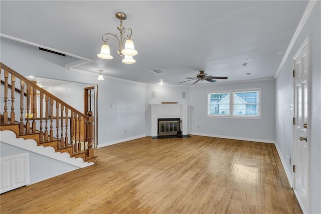 174 Celia Dr, Luling, LA 70070 - unfurnished living room with a ceiling fan, light wood-type flooring, crown molding, a fireplace with flush hearth, and stairs