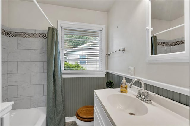 174 Celia Dr, Luling, LA 70070 - bathroom featuring vanity, a wainscoted wall, and shower / tub combo with curtain