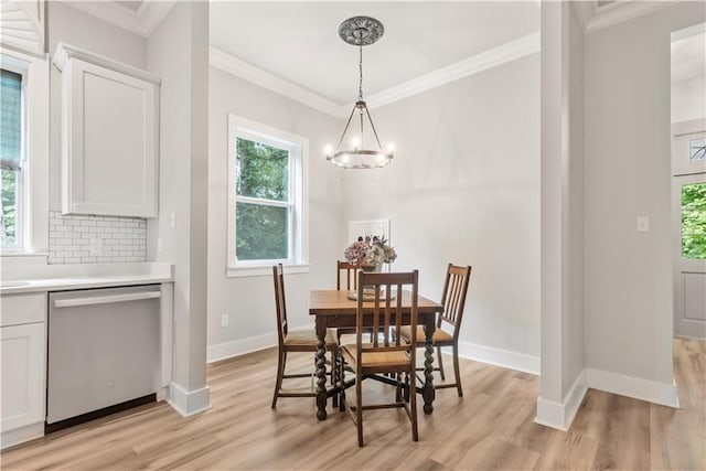71434 Saint Joseph St, Abita Springs, LA 70420 - dining room with ornamental molding, light wood-style flooring, and a chandelier