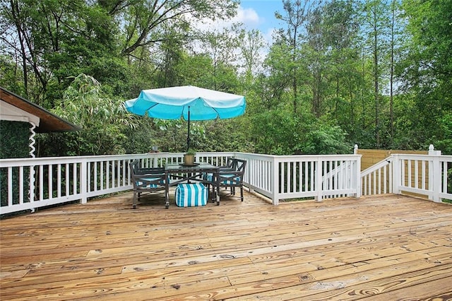 71434 Saint Joseph St, Abita Springs, LA 70420 - wooden terrace with outdoor dining space and view of wooded area