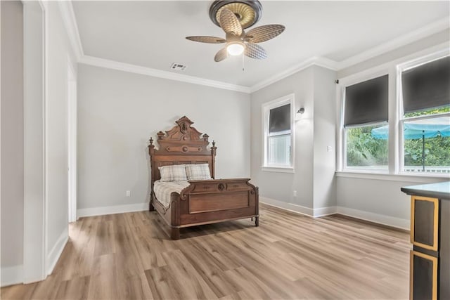 71434 Saint Joseph St, Abita Springs, LA 70420 - bedroom with light wood-style flooring, crown molding, and ceiling fan