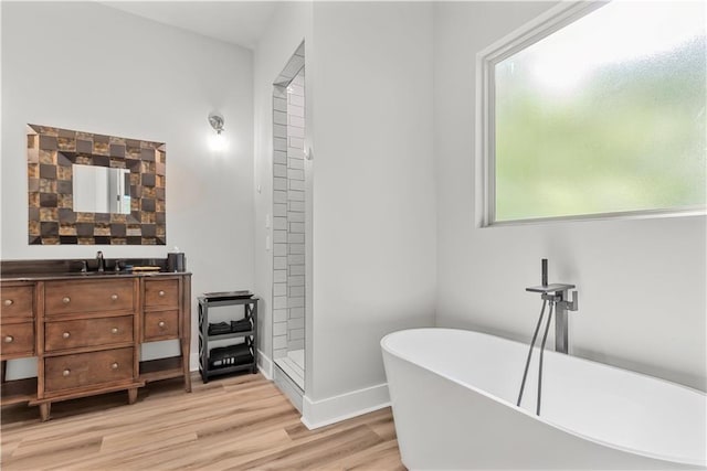 71434 Saint Joseph St, Abita Springs, LA 70420 - bathroom with vanity, a freestanding tub, wood finished floors, and a shower