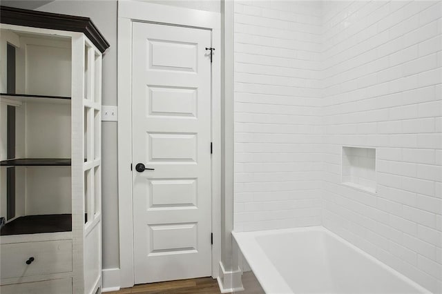 71434 Saint Joseph St, Abita Springs, LA 70420 - bathroom with wood finished floors and bathtub / shower combination