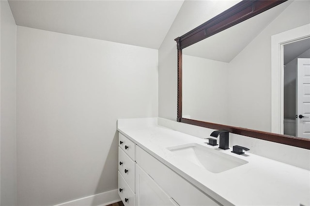 71434 Saint Joseph St, Abita Springs, LA 70420 - bathroom with vaulted ceiling and vanity