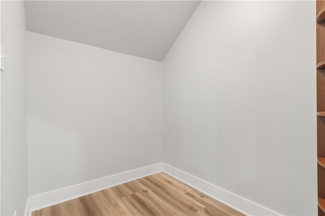 71434 Saint Joseph St, Abita Springs, LA 70420 - empty room featuring light wood-type flooring and vaulted ceiling