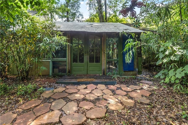 71434 Saint Joseph St, Abita Springs, LA 70420 - property entrance with french doors and a metal roof