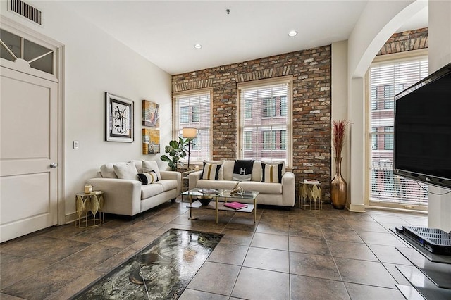 333 Girod St Unit 304, New Orleans, LA 70130 - living room with plenty of natural light and brick wall