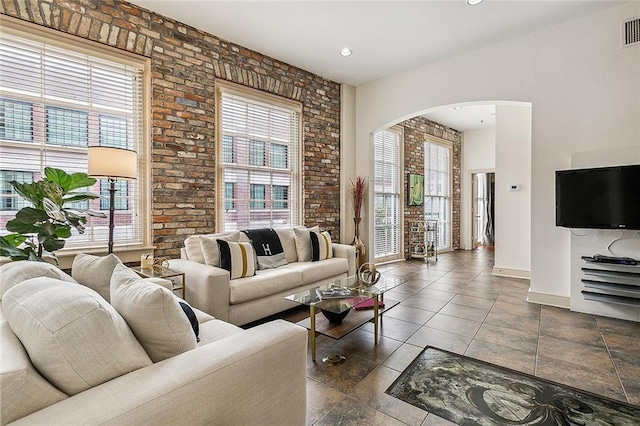 333 Girod St Unit 304, New Orleans, LA 70130 - living room with arched walkways and brick wall