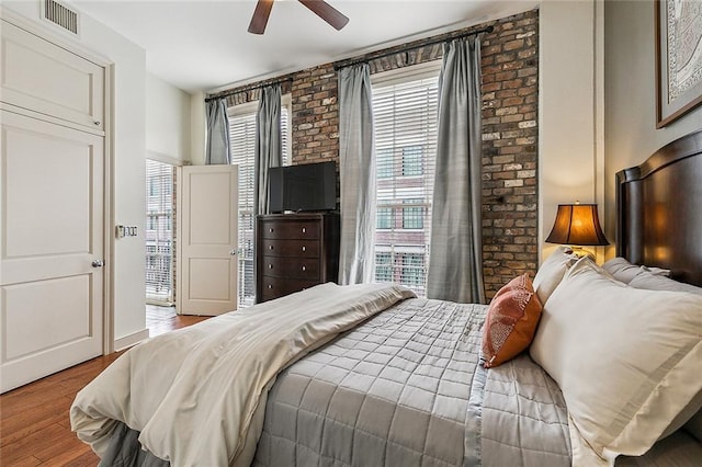 333 Girod St Unit 304, New Orleans, LA 70130 - bedroom featuring wood finished floors and a ceiling fan