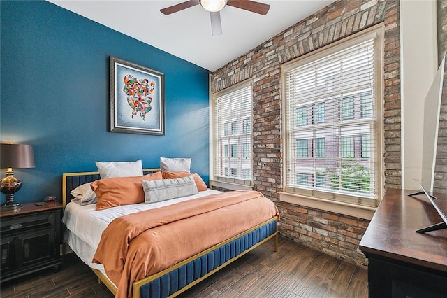 333 Girod St Unit 304, New Orleans, LA 70130 - bedroom with brick wall, dark wood-style flooring, and ceiling fan