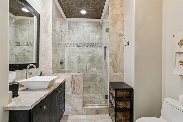 333 Girod St Unit 304, New Orleans, LA 70130 - bathroom featuring vanity, a shower stall, and tile walls