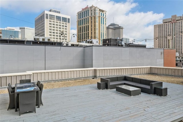 333 Girod St Unit 304, New Orleans, LA 70130 - wooden terrace featuring an outdoor living space and a city view