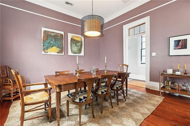 422 Alix St, New Orleans, LA 70114 - dining space featuring wood finished floors and ornamental molding