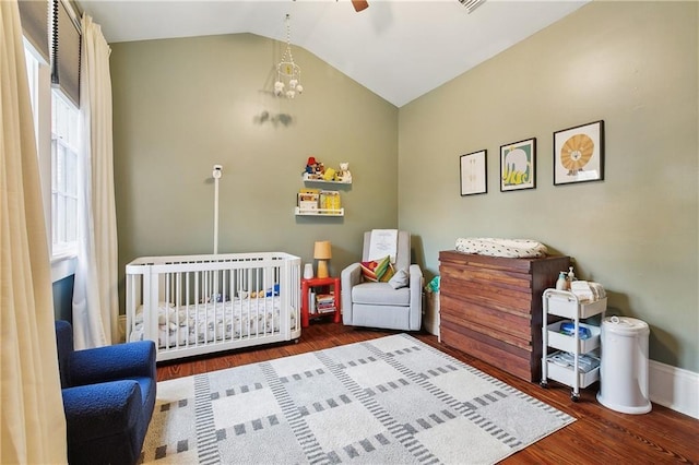 422 Alix St, New Orleans, LA 70114 - bedroom with a crib, wood finished floors, lofted ceiling, and ceiling fan