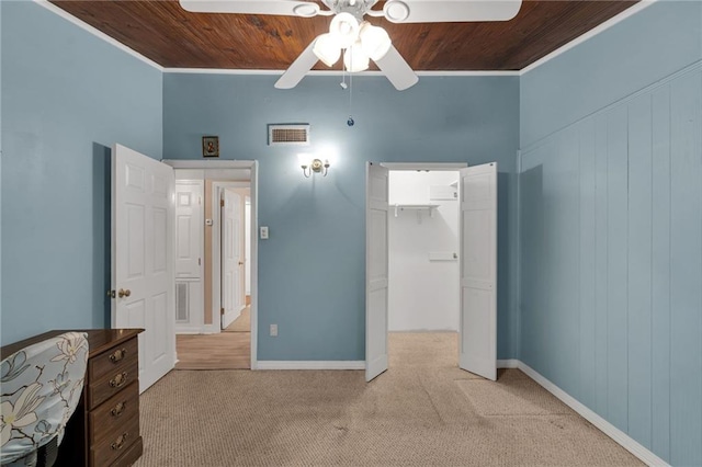 7 Albert Ct, Metairie, LA 70003 - unfurnished bedroom featuring wooden ceiling, carpet, ornamental molding, a walk in closet, and a closet