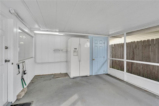 7 Albert Ct, Metairie, LA 70003 - garage with white refrigerator with ice dispenser