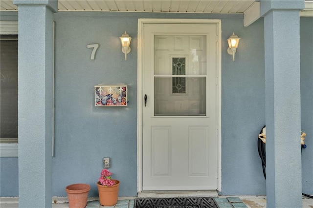 7 Albert Ct, Metairie, LA 70003 - view of exterior entry with stucco siding