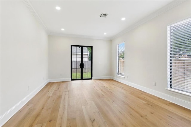 4544 Prairie St, Metairie, LA 70001 - unfurnished room featuring french doors, ornamental molding, light wood-type flooring, and recessed lighting
