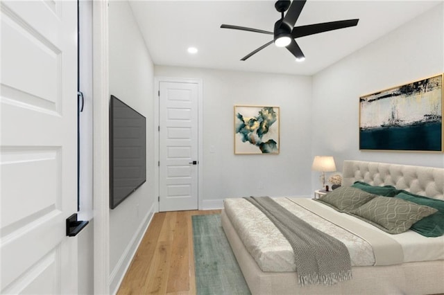 4544 Prairie St, Metairie, LA 70001 - bedroom with light wood finished floors, recessed lighting, and a ceiling fan