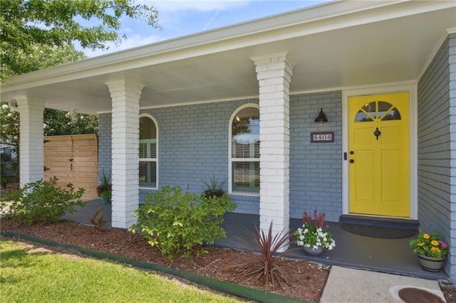 4404 Belle Dr, Metairie, LA 70006 - doorway to property featuring brick siding and covered porch