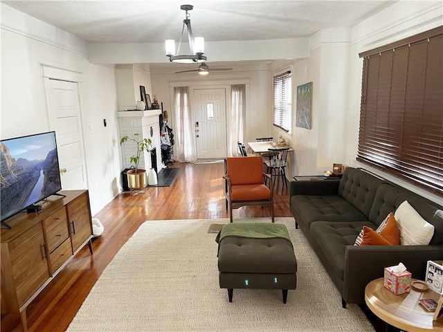 7935 Fig St, New Orleans, LA 70125 - living room with wood finished floors and a fireplace