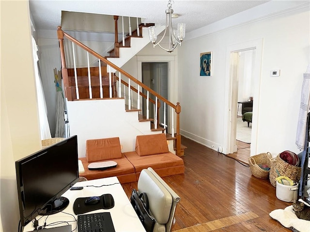 7935 Fig St, New Orleans, LA 70125 - living area with a chandelier, wood-type flooring, stairs, and a textured ceiling
