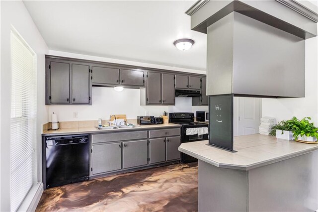 42653-42663 Edgewater Ln, Hammond, LA 70403 - kitchen with black appliances, under cabinet range hood, a peninsula, finished concrete flooring, and gray cabinets