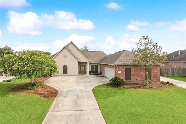 13795 Shady Hollow Dr, Denham Springs, LA 70726 - view of front of home with concrete driveway, brick siding, a garage, and a shingled roof