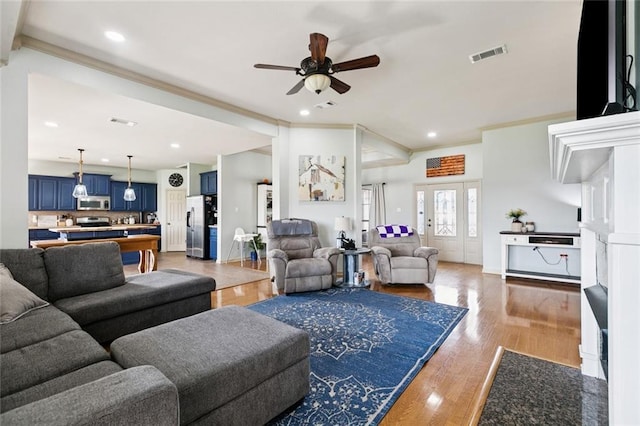 13795 Shady Hollow Dr, Denham Springs, LA 70726 - living room with crown molding, a ceiling fan, wood finished floors, and recessed lighting
