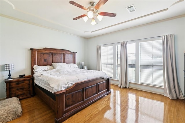 13795 Shady Hollow Dr, Denham Springs, LA 70726 - bedroom with light wood-type flooring, crown molding, and ceiling fan