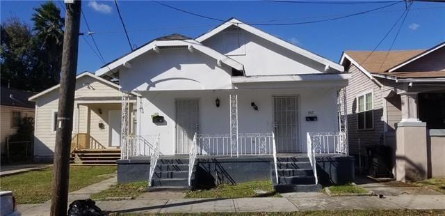 1317-1919 S Genois St, New Orleans, LA 70125 - bungalow featuring a porch