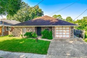 2219 Mercedes Blvd, New Orleans, LA 70114 - view of front of home with driveway, an attached garage, and a front yard