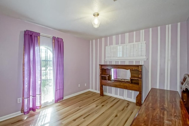 2219 Mercedes Blvd, New Orleans, LA 70114 - unfurnished living room with wood finished floors and baseboards