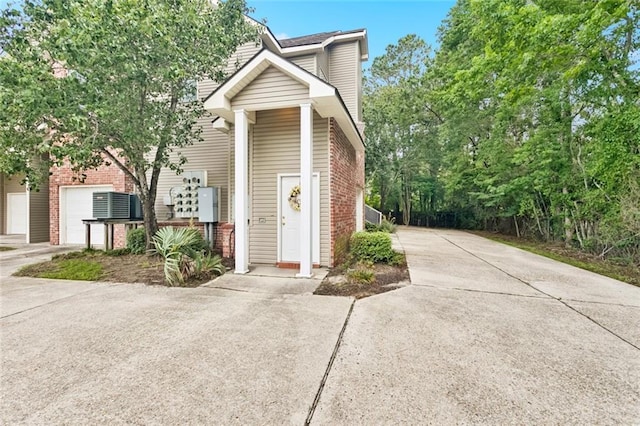 521 Spartan Dr Unit 10207, Slidell, LA 70458 - townhome / multi-family property featuring driveway and brick siding