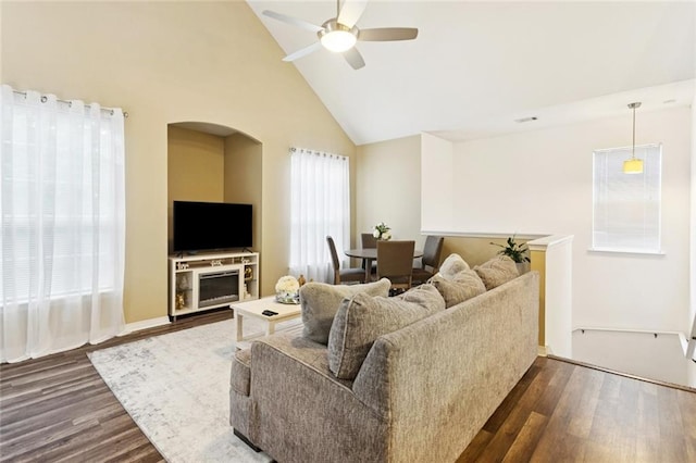 521 Spartan Dr Unit 10207, Slidell, LA 70458 - living room featuring dark wood finished floors, a ceiling fan, arched walkways, and high vaulted ceiling