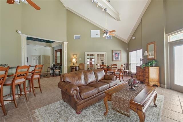 521 Spartan Dr Unit 10207, Slidell, LA 70458 - tiled living room with ceiling fan and high vaulted ceiling